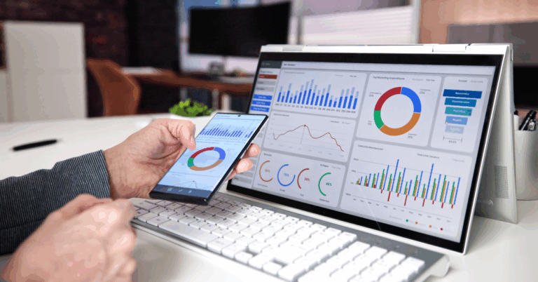 A professional analyzing real-time financial dashboards on a tablet and monitor, showing charts, graphs, and key performance indicators for accounting automation.