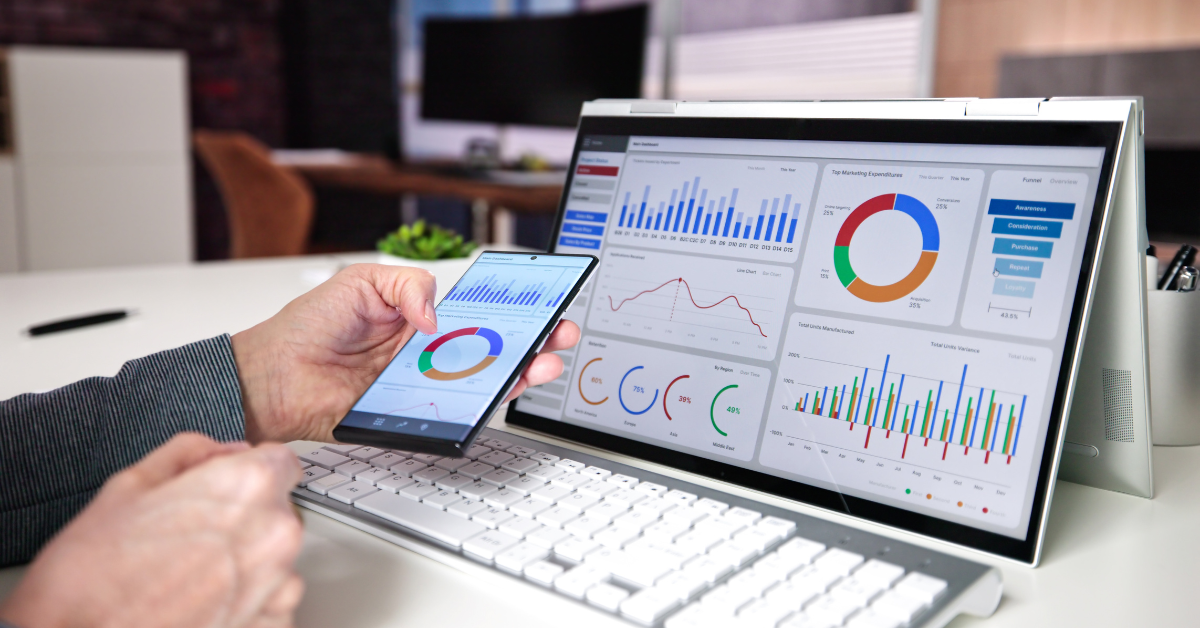 A professional analyzing real-time financial dashboards on a tablet and monitor, showing charts, graphs, and key performance indicators for accounting automation.