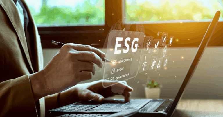 A professional using a laptop and stylus to analyze ESG data, highlighting environment, social, and governance icons on a transparent digital interface.